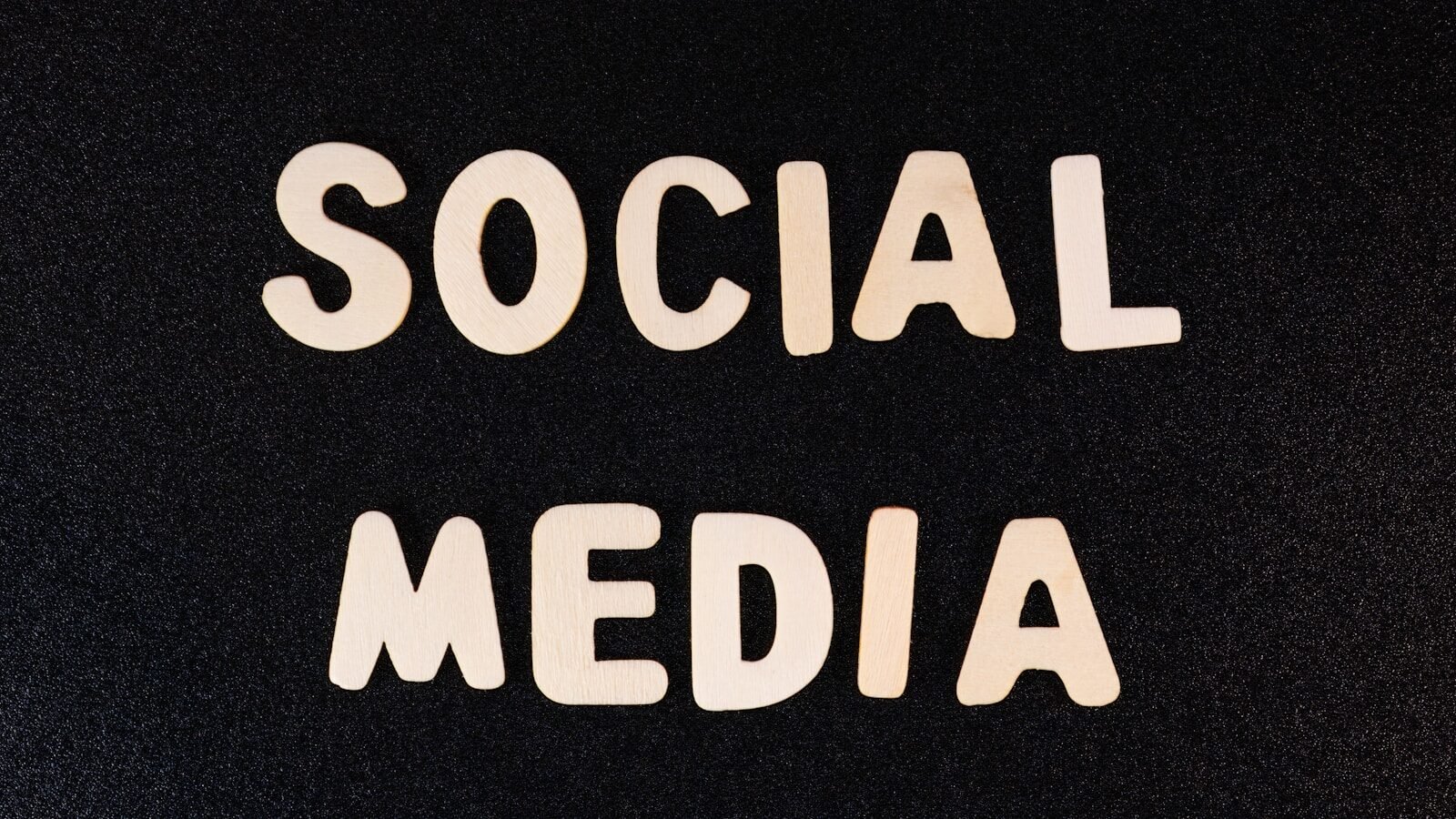 the word social media written in white type on a black background