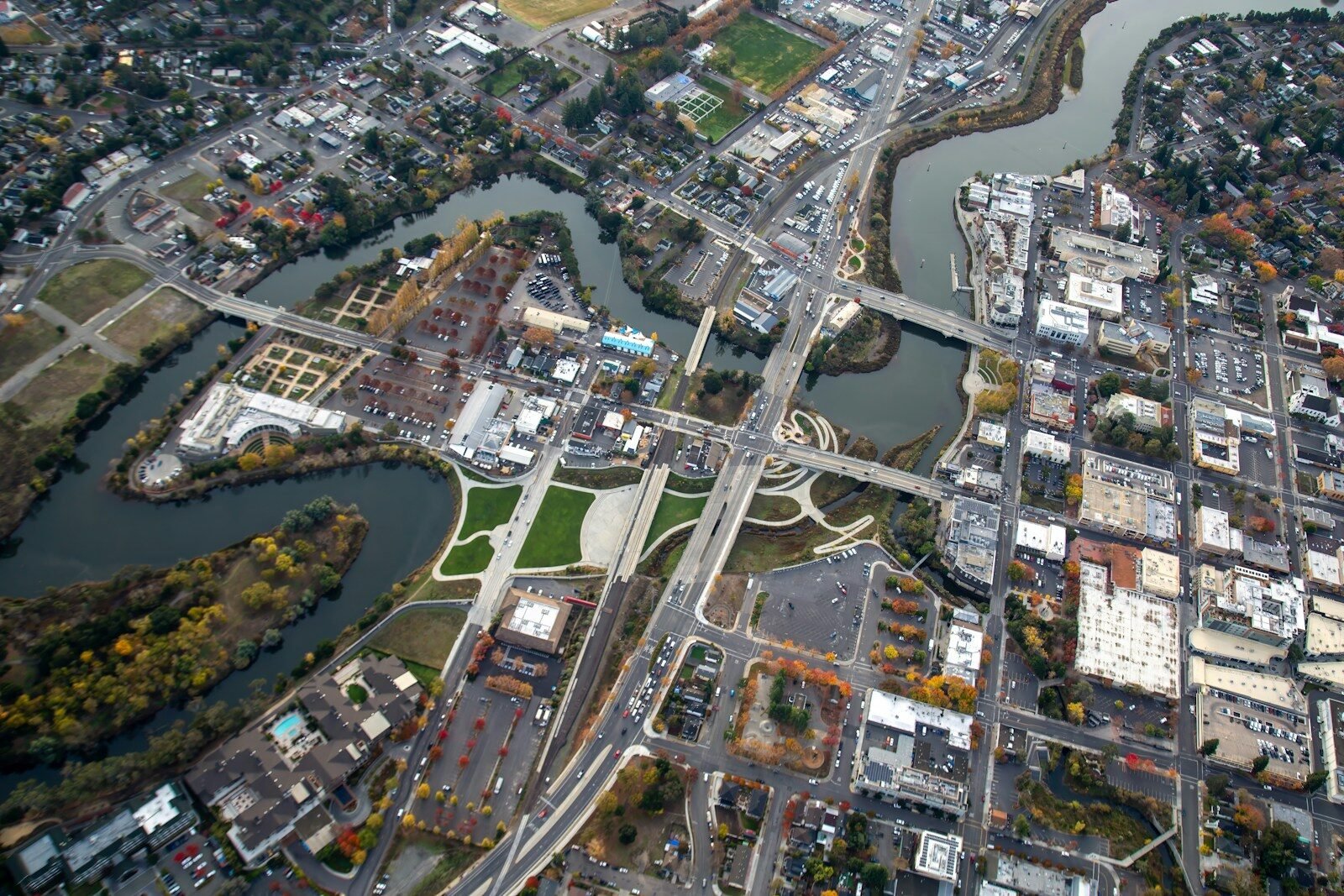 an aerial view of a city with a river running through it